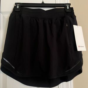 Lululemon hotty hot high rise skirt; black, new with tags, size 6